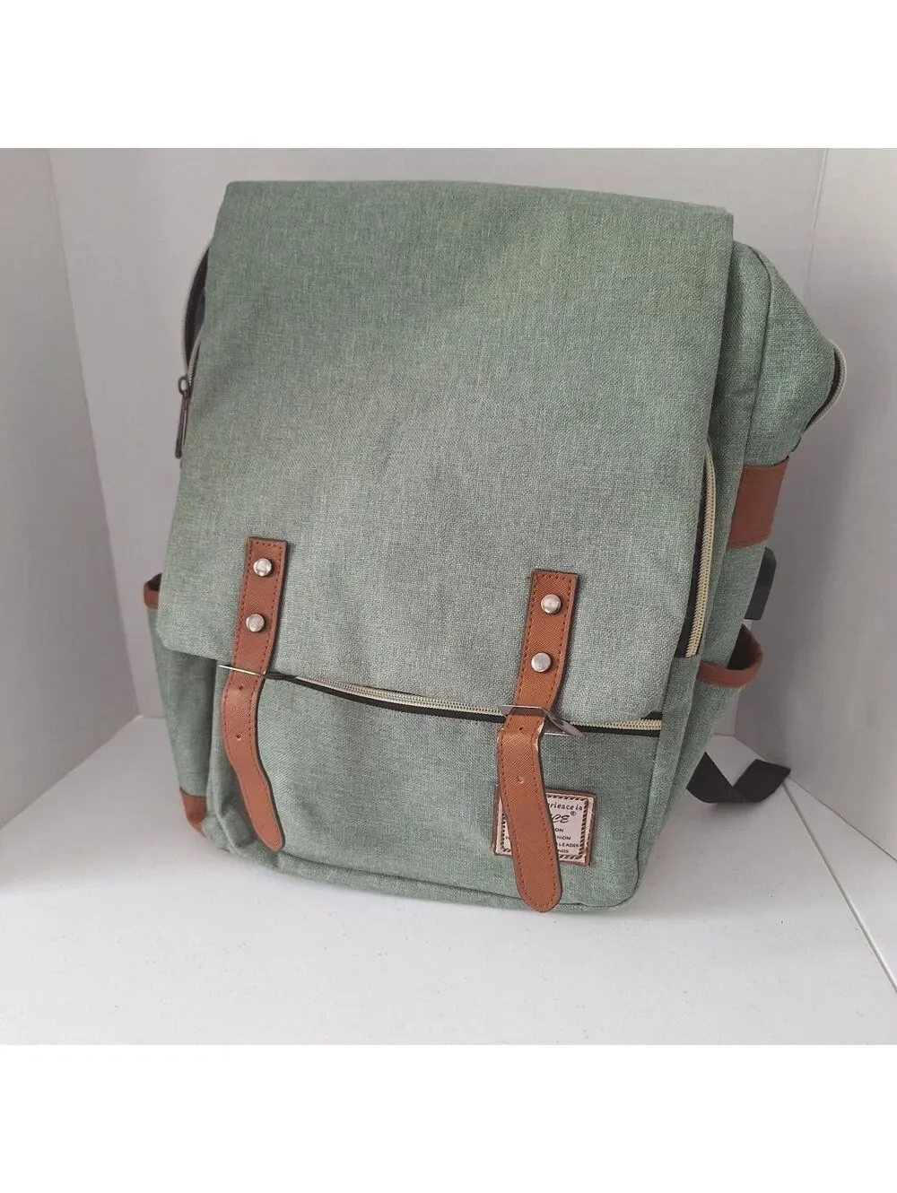 UGRACE Green Backpack with Zip Closure, Brown Accents, Pockets